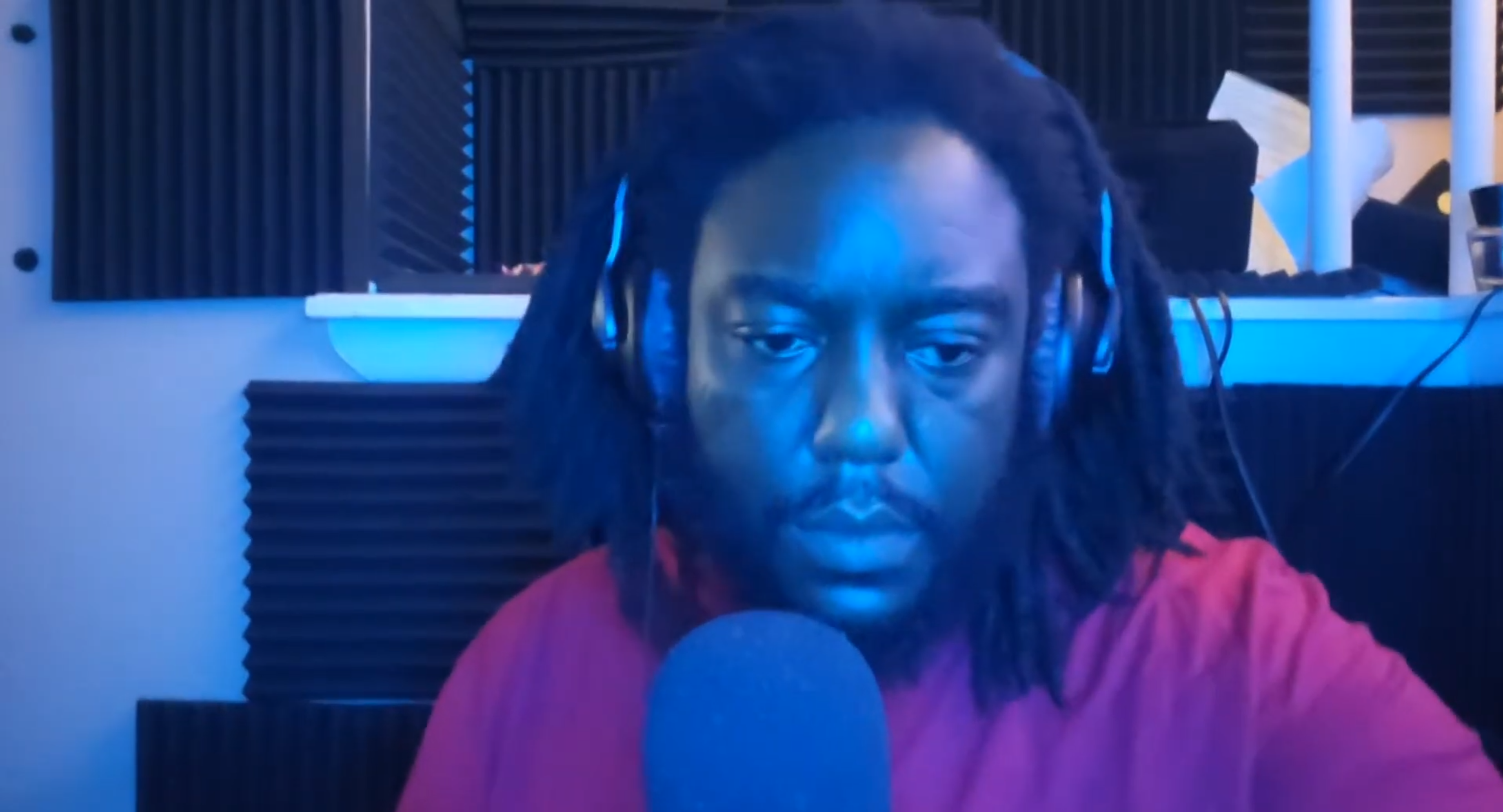 King Dotta livestream showing grainy webcam quality and poor blue lighting